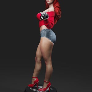May include: A statue of a woman with long red hair, wearing a red off-the-shoulder top, denim shorts, and red high heels. She holds a vintage camera. The statue stands on a black base with a white design.