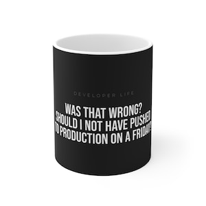 May include: Black ceramic mug with a white interior. The mug has the text "DEVELOPER LIFE WAS THAT WRONG? SHOULD I NOT HAVE PUSHED TO PRODUCTION ON A FRIDAY?" in white. A humorous gift for software developers.
