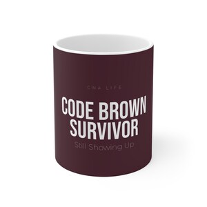 Code Brown Survivor Still Showing Up Mug | CNA Gift | Deep Burgundy