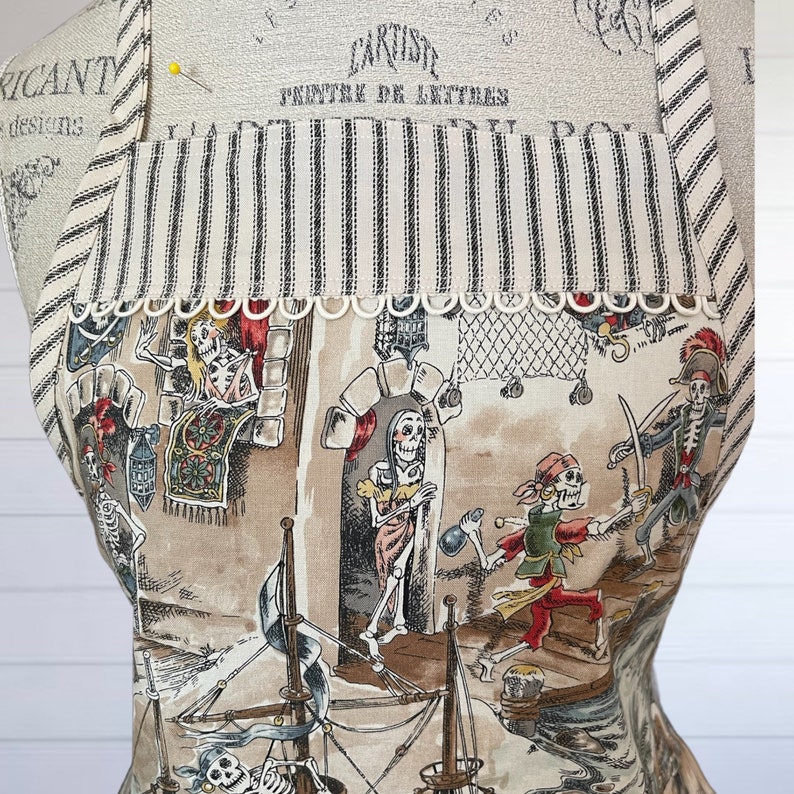 Colorful Caribbean Skeleton Pirates on Full Apron, Cream and Brown