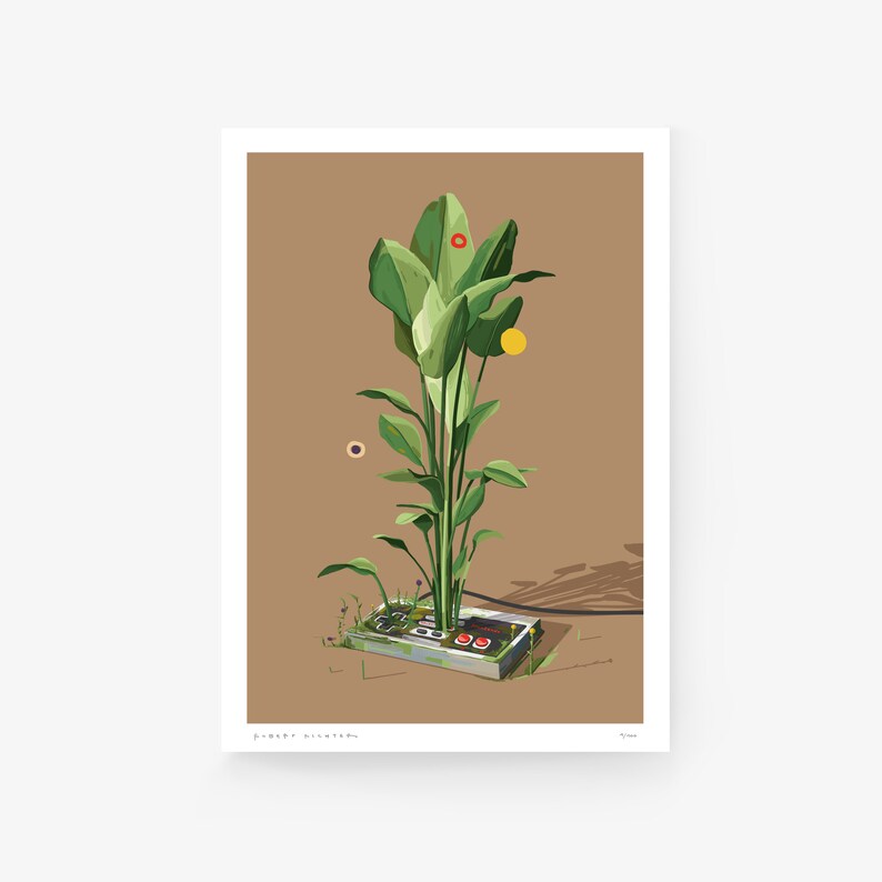 May include: A green plant growing out of an old, grey Nintendo Entertainment System controller. The controller is on a brown surface with a shadow.