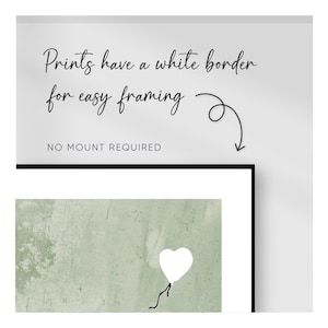 May include: A green and white abstract art print with a white heart-shaped balloon. The print has a white border for easy framing. "NO MOUNT REQUIRED" is written at the bottom of the print.