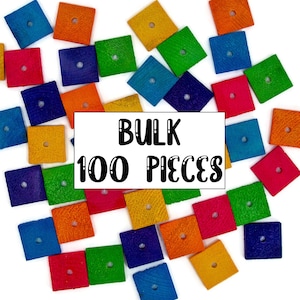 May include: A bulk pack of 100 colorful wooden squares with a hole in the center. The squares are scattered on a white background. The text "BULK 100 PIECES" is printed on a white rectangle in the center of the image.