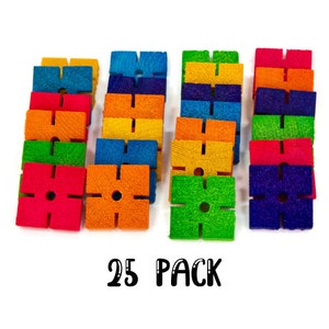 May include: A set of 25 colorful wooden blocks with a cross shape and a hole in the center. The blocks are arranged in stacks of five, with each stack featuring a different color: red, orange, yellow, green, blue, and purple. The blocks are labeled "25 PACK".