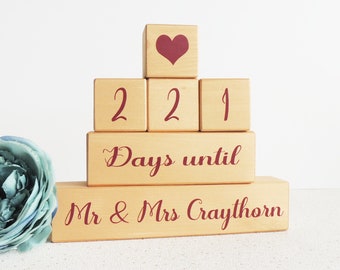 May include: Wooden countdown blocks with a red heart on top, stacked to spell out "221 Days until Mr & Mrs Craythorn".