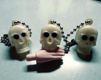 Mechanical chomping jaw skull charms from 1960's NOS, vending machine gumball prizes