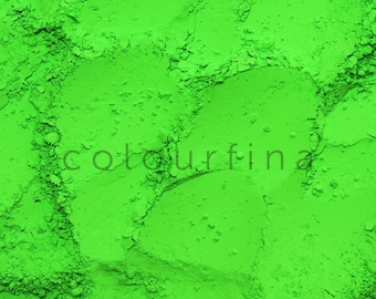 May include: Close-up of a bright green powder, showing its texture and fine particles.