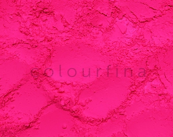 May include: Close-up of a bright pink powder, a vibrant and textured surface.