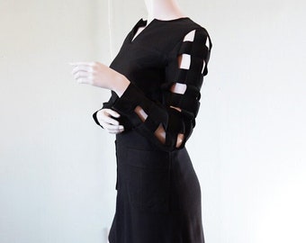 mod 1960s mini-dress with cage cut-out effect on arms
