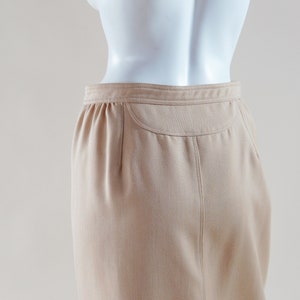 1970s Courrèges wrap skirt tan beige vintage designer knee length skirt with silver buttons and leather nameplate logo at waist image 6