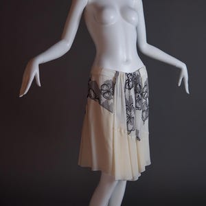 S/S 2007 John Galliano runway silk chiffon layered flouncy skirt in black and white hibiscus floral with draped panel