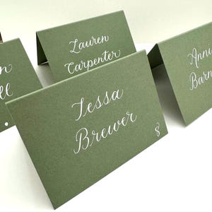 Green calligraphy tented place cards