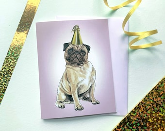 May include: A light purple greeting card with a drawing of a pug wearing a gold party hat. The pug is sitting and looking at the viewer.