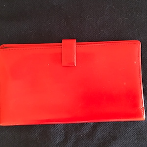 Cartera de viaje vintage de cuero rojo