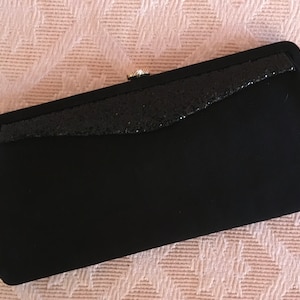 Bolsa de noite preta brilhante