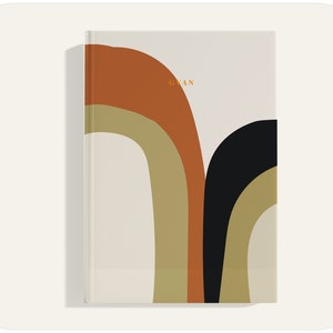 May include: A beige journal with a colorful abstract design on the cover. The design features three curved shapes in shades of orange, brown, and black. The word "GIAN" is printed in orange on the cover.