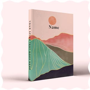 May include: A pink and green journal with a mountain landscape and a sun on the cover. The text "Name" is printed on the cover.