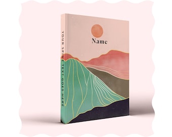 May include: A pink and green journal with a mountain landscape and a sun on the cover. The text "Name" is printed on the cover.