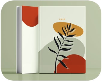 Puede incluir: Un diario blanco con un fondo verde y una rama negra con hojas. El diario tiene un diseño abstracto rojo y naranja en la portada. El texto "GYAN" está impreso en naranja en la portada.