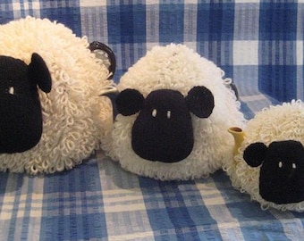 Sheep tea cosies