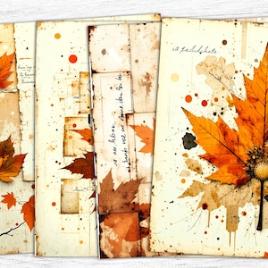 May include: A collection of vintage-style paper prints featuring autumn leaves in shades of orange and brown. The prints have a distressed look with ink splatters and handwritten text, evoking a rustic, antique aesthetic. The leaves are the focal point, with detailed veins and textures.