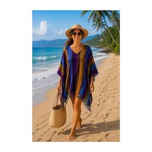 May include: A V-neck poncho featuring vertical stripes in shades of purple, blue, yellow, and brown, finished with a fringed hem. The garment is paired with a wide-brimmed straw hat and a woven straw tote bag, creating a cohesive beach ensemble.