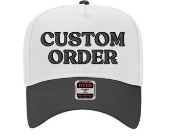 May include: White and black trucker hat with the text "CUSTOM ORDER" embroidered in black on the front. The hat has a black bill and a black label with the word "OTTO" in red.