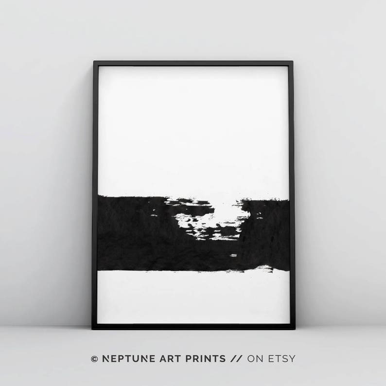May include: Black and white abstract art print with a single horizontal brushstroke in black across the bottom half of the print. The print is framed in a black frame.