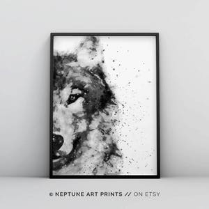 May include: Black and white watercolour painting of a wolf's face. The wolf's eye is visible and the background is a white splatter pattern.