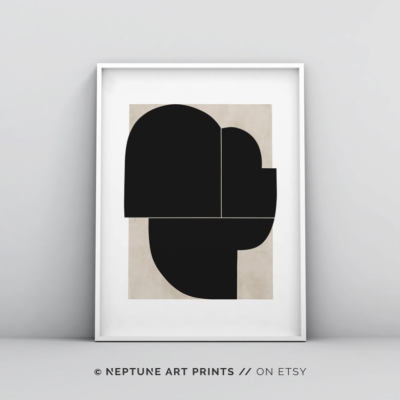 May include: Abstract geometric art print with black shapes on a beige background. The print is framed in a white frame.