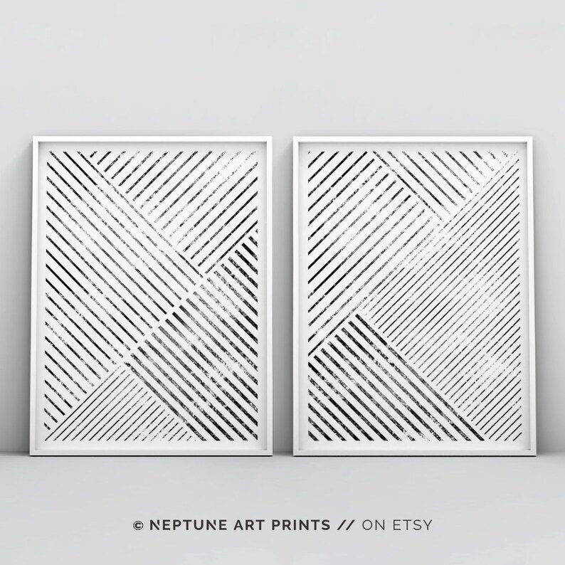 May include: Two black and white abstract geometric prints with a white background and black lines. The prints are framed in white frames and are hanging on a white wall. The text "&copy; NEPTUNE ART PRINTS // ON ETSY" is at the bottom of the image.