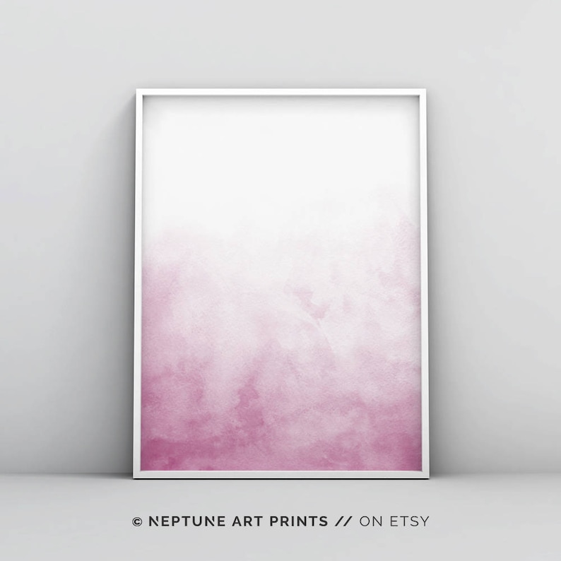May include: A framed watercolor print with a pink ombre effect, fading from a darker pink at the bottom to a lighter pink at the top. The print is in a white frame.