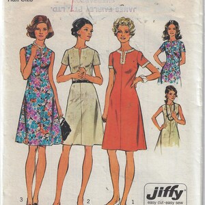 May include: Simplicity sewing pattern number 6079 for a dress. The pattern includes four different dress styles, all with a V-neckline and a fitted bodice. The dress styles include a sleeveless dress with a floral print, a short-sleeved dress with a solid colour, a long-sleeved dress with a solid colour, and a sleeveless dress with a solid colour. The pattern is for a half size and is available in size 14 1/2. The bust measurement is 37 inches or 94 cm.