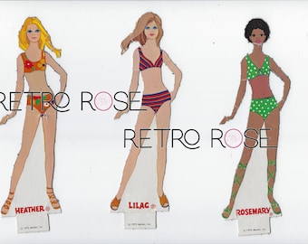 Vintage paper dolls with groovy seventies wardrobe