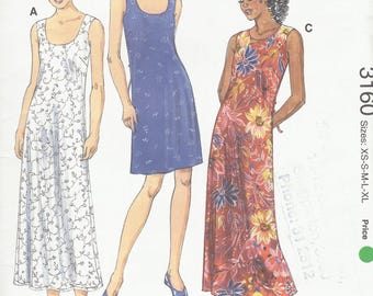 May include: A sewing pattern for three sleeveless dresses. The pattern is called Kwik Sew and the pattern number is 3160. The dresses are shown in white with floral embroidery, blue with white floral print, and red with a large floral print.