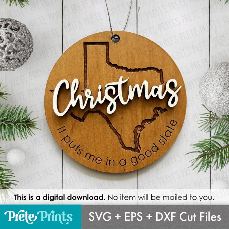 May include: A round wooden Christmas ornament featuring the state of Texas. The word "Christmas" is in white script across the state outline. The phrase "It puts me in a good state" is inscribed around the edge.