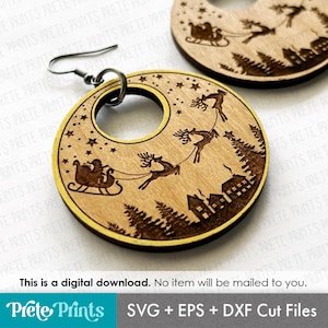 May include: Wooden Christmas earrings with a circular design. The earrings feature a laser-cut image of Santa Claus in a sleigh pulled by reindeer over a village and trees. The earrings have a gold-colored border and a silver hook. The text "This is a digital download. No item will be mailed to you."