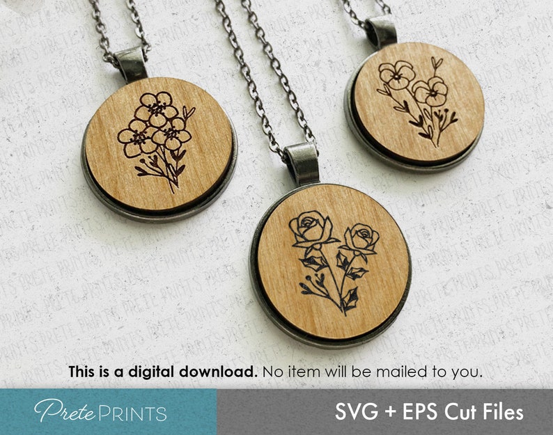 Puede incluir: Dos collares colgantes de madera con cadenas plateadas. Un collar presenta un dise&ntilde;o floral con tres flores y hojas. El otro collar presenta un dise&ntilde;o floral con dos rosas y hojas.