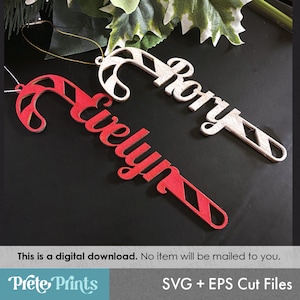 May include: Two red and white candy cane ornaments with the names "Evelyn" and "Rory" cut out in white. This is a digital download, no item will be mailed to you. SVG + EPS Cut Files.