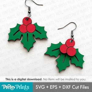 May include: A pair of Christmas-themed earrings featuring a holly leaf design. Each earring has a green holly leaf shape with three red berries. The earrings are suspended from silver-colored fish hook ear wires. The image also contains the text "This is a digital download. No item will be mailed to you."