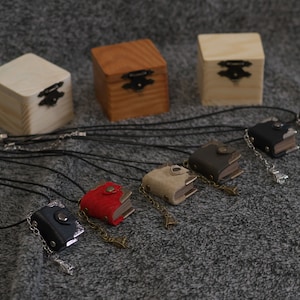 One inch tiny handmade leather notebook pendant in wooden box