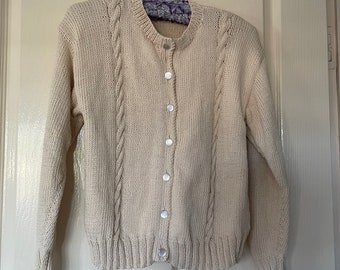 Girl's 100% cotton button through cardigan with round neck.