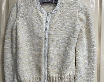 Girl's 100% button through cotton cardigan with round neck.