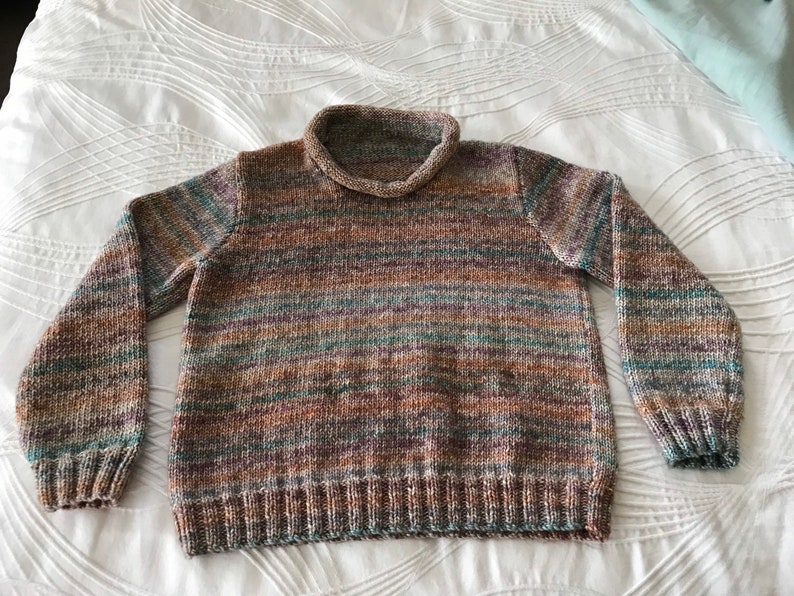 Unisex kid's jumper / sweater with rolled neck. Variegated colours. image 1