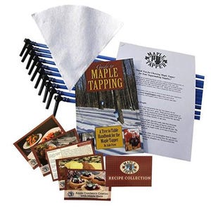 May include: A collection of maple tapping supplies, including a "Guide to Maple Tapping" handbook, recipe cards, a filter, and tapping spouts. The recipe cards feature images of dishes with maple glaze.