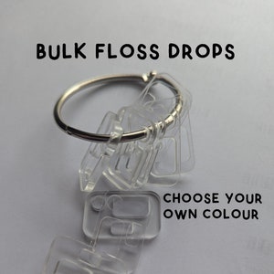May include: Bulk floss drops in clear plastic, attached to a silver ring. Choose your own color.