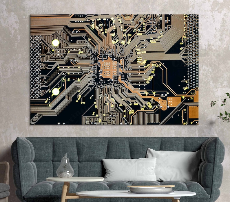 May include: A close-up of a circuit board with intricate copper traces and gold-colored components. The board is black with a textured surface.