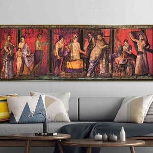 May include: A vintage painting depicting a scene from ancient Roman life. The painting features a group of people in colorful robes and tunics, standing and interacting with each other. The scene is set in a room with red walls and a tiled floor. The painting is framed in a gold frame.