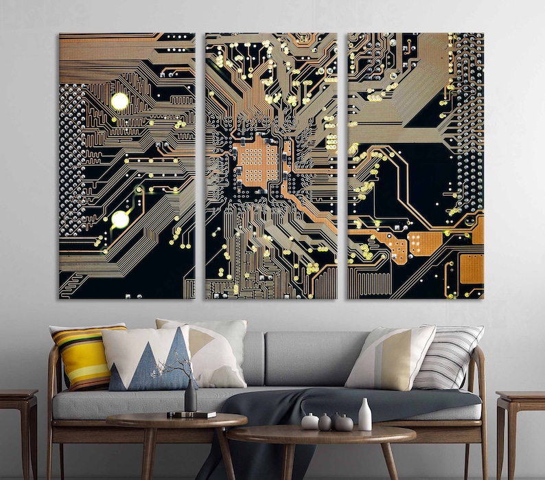 May include: A close-up of a circuit board with intricate copper traces and gold connectors. The board is divided into three sections, each with a unique pattern. The colors are black, gold, and copper.