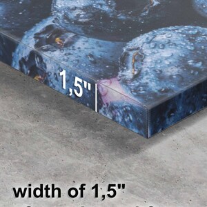 May include: Close-up of a canvas print of blueberries with a 1.5" wide wooden subframe.